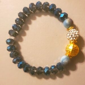 Handmade by my daughter. Elegant Blue and Gold Beaded Bracelet